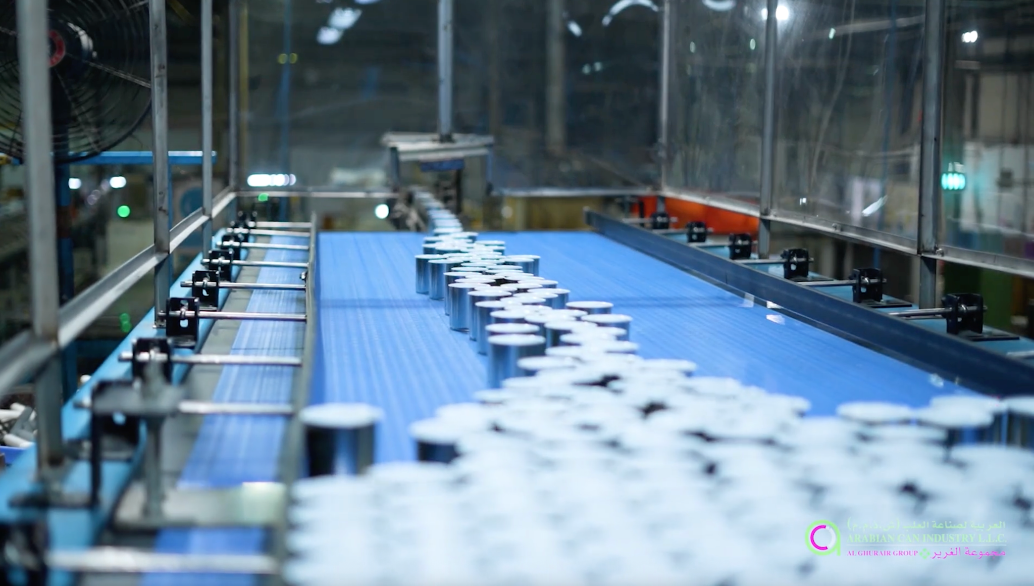 Production line with tinplate cans on a conveyor belt